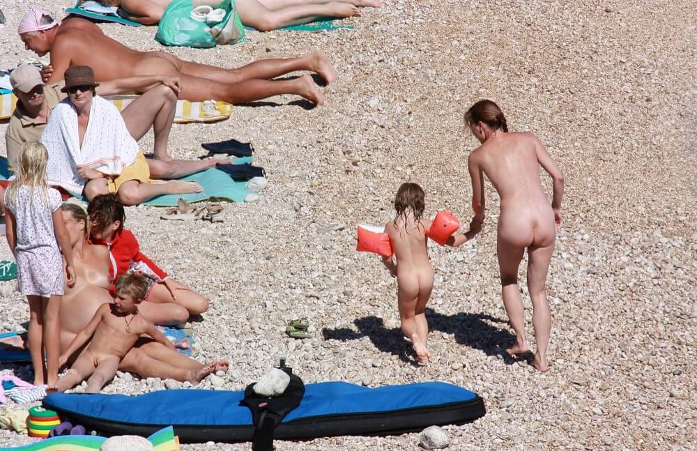 Orange Floaty Safety First Naturist pics - nudism in the world